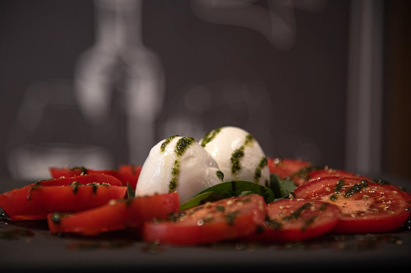 Burrata caprese with heirloom tomatoes